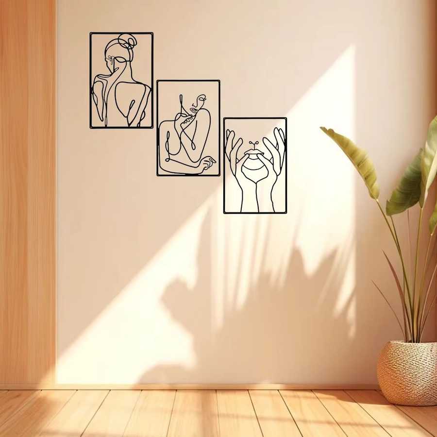 Modern abstract metal wall art set of 3 displayed in a sunlit room with minimalist decor, enhancing indoor aesthetic appeal.