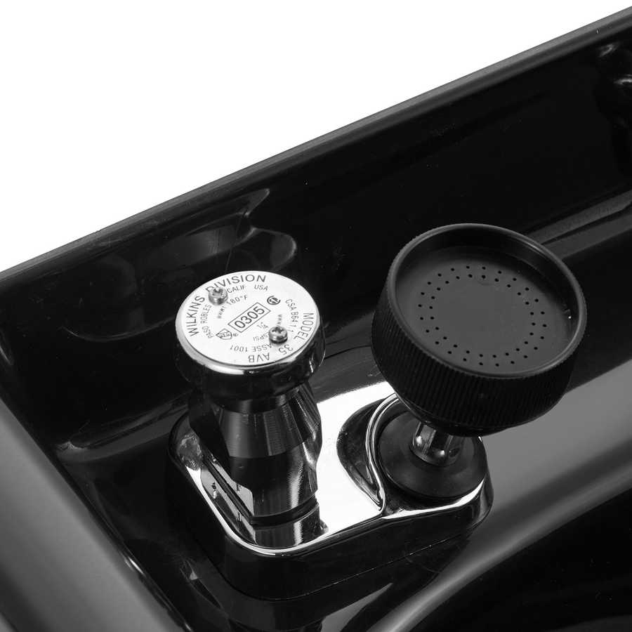 Close-up of a black and chrome gas valve on a stove