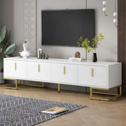 Modern TV stand for large TVs up to 80'' in white and gold with geometric doors and gold legs, perfect for stylish living rooms.