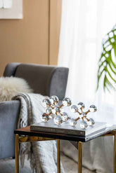 Decorative object on a book on a side table in a living room setting