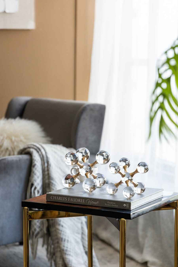 Decorative object on a book on a side table in a living room setting