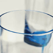 Close-up of the rim of a LeadingWare unbreakable wine glass, showcasing smooth BPA-free acrylic construction in a modern blue design.