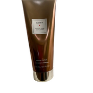 Front view of Glow It Gradual Glow Body Lotion Medium to Tan 6.7 fl oz with clear label, designed for smooth, radiant skin and gradual tanning.