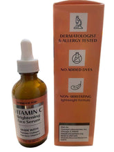 Bottle of vitamin C serum with a dropper on a blurred background