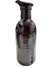 Bottle with a pump dispenser on a textured surface