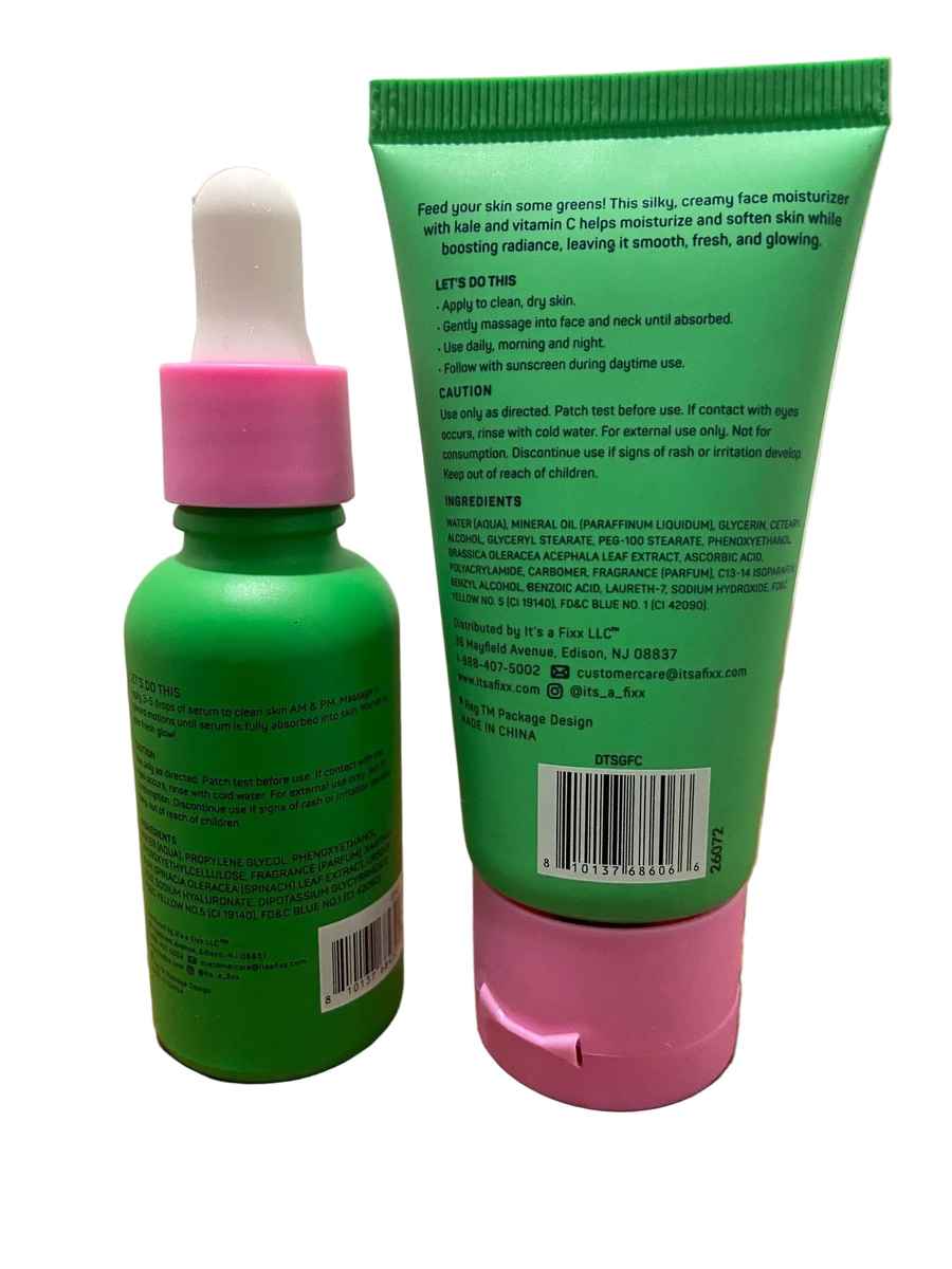 A green skincare tube with a pink cap and a matching green dropper bottle with a pink cap, both showing the back labels, placed on a wooden surface.