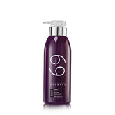 Purple shampoo bottle with pump on a white background
