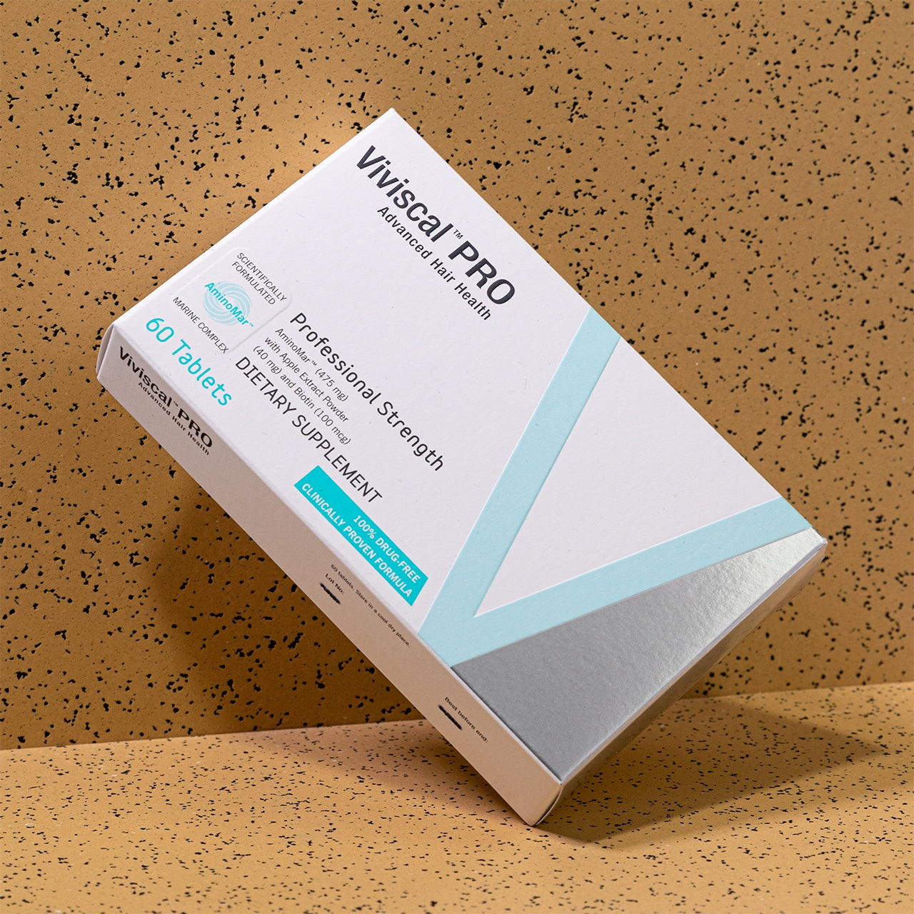 Viviscal Pro supplement box on a textured brown background