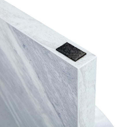 Protective felt pad detail on MDF white round coffee table leg, ensuring floor safety and stability.