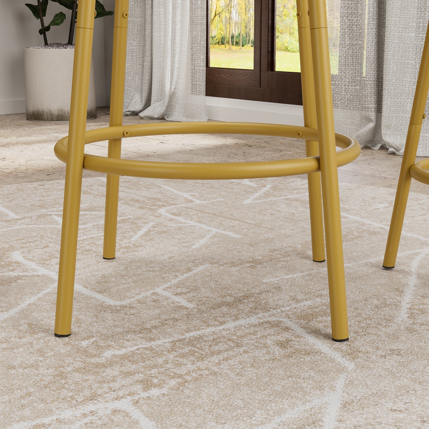 Detail of the gold metal footrest and legs of the 3-Piece Bar Table Set with Stools, highlighting sturdy and stylish construction.