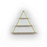 Wall-mounted shelf with gold triangular brace on a white background