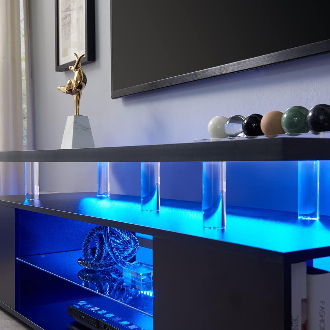 a blue shelf with a glass case on top of it