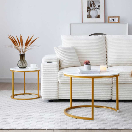 White gray top Nesting Round Coffee Table Set used separately beside a white couch, showcasing versatile placement and modern design.