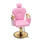 A pink salon barber chair with gold metal armrests, base, and headrest support, shown against a plain white background.