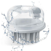 White bath brush with water splashes on a white background