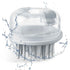 White bath brush with water splashes on a white background