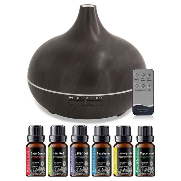 A dark brown wood-grain essential oil diffuser with a remote control and six small essential oil bottles labeled Sweet Orange, Tea Tree, Lavender, Eucalyptus, Lemongrass, and Peppermint, arranged on a white background.