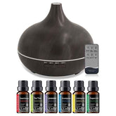 A dark brown wood-grain essential oil diffuser with a remote control and six small essential oil bottles labeled Sweet Orange, Tea Tree, Lavender, Eucalyptus, Lemongrass, and Peppermint, arranged on a white background.