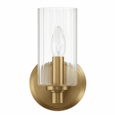 Gold wall sconce with clear glass shade on a white background