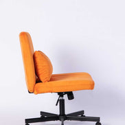 Side profile of the Orange Velvet Office Chair showing thick cushioned seat and adjustable height lever for comfort.