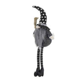 Whimsical black gnome Halloween decor plush toy with tall polka dot hat, long striped legs, and faux fur beard, perfect for holiday home décor