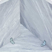 Interior view of MDF white round coffee table base with metal brackets, showing solid construction and modern design.