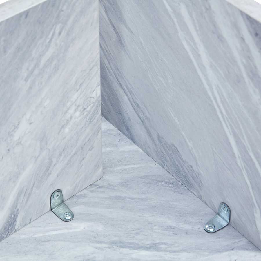 Interior view of MDF white round coffee table base with metal brackets, showing solid construction and modern design.