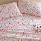 Holiday Doodles - Twin XL Cotton Flannel Sheet Set close-up of pillowcases and sheets with red festive doodles for a cheerful holiday bedroom look.