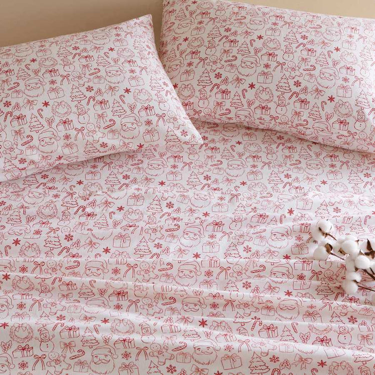 Holiday Doodles - Twin XL Cotton Flannel Sheet Set close-up of pillowcases and sheets with red festive doodles for a cheerful holiday bedroom look.