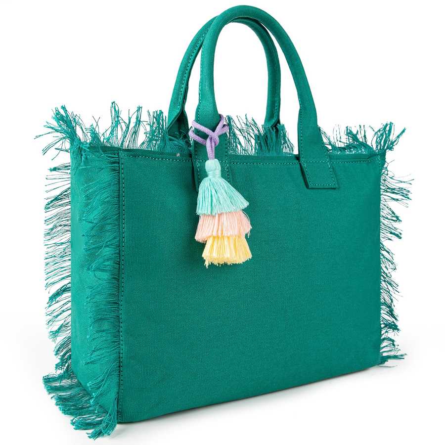 Green handbag with fringe details and colorful tassels on a white background