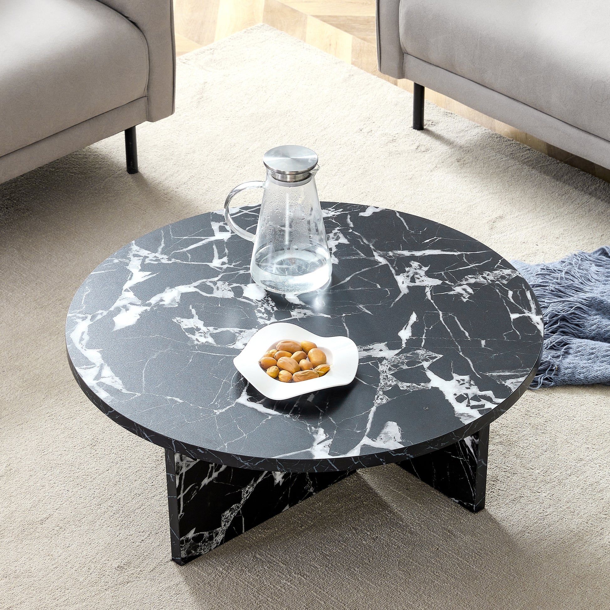 Top-down view of black MDF round coffee table with modern minimalism, showcasing its elegant marble-like surface.