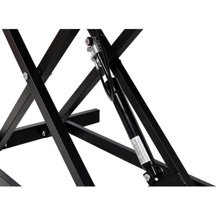 Close-up of gas spring lift mechanism on adjustable height laptop desk, ensuring easy and secure height adjustments.