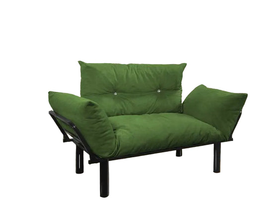 Green futon sofa against a brick wall