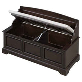 A dark brown wooden storage bench with a cushioned seat, shown with the lid open to reveal storage space and a gas strut support, isolated on a white background.