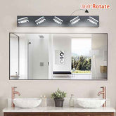 Bathroom vanity with large mirror, lights, and decor elements.