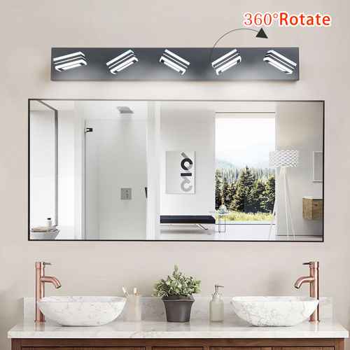 Bathroom vanity with large mirror, lights, and decor elements.