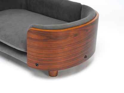 Close-up of curved solid wood frame and velvet cushion on Scandinavian Elevated Dog Bed, highlighting premium design.