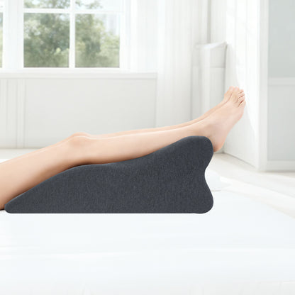 Legs elevated on Ergonomic Memory Foam Bed Pillow - Spinal Support Pillow, showing its versatility for lower body support and circulation.