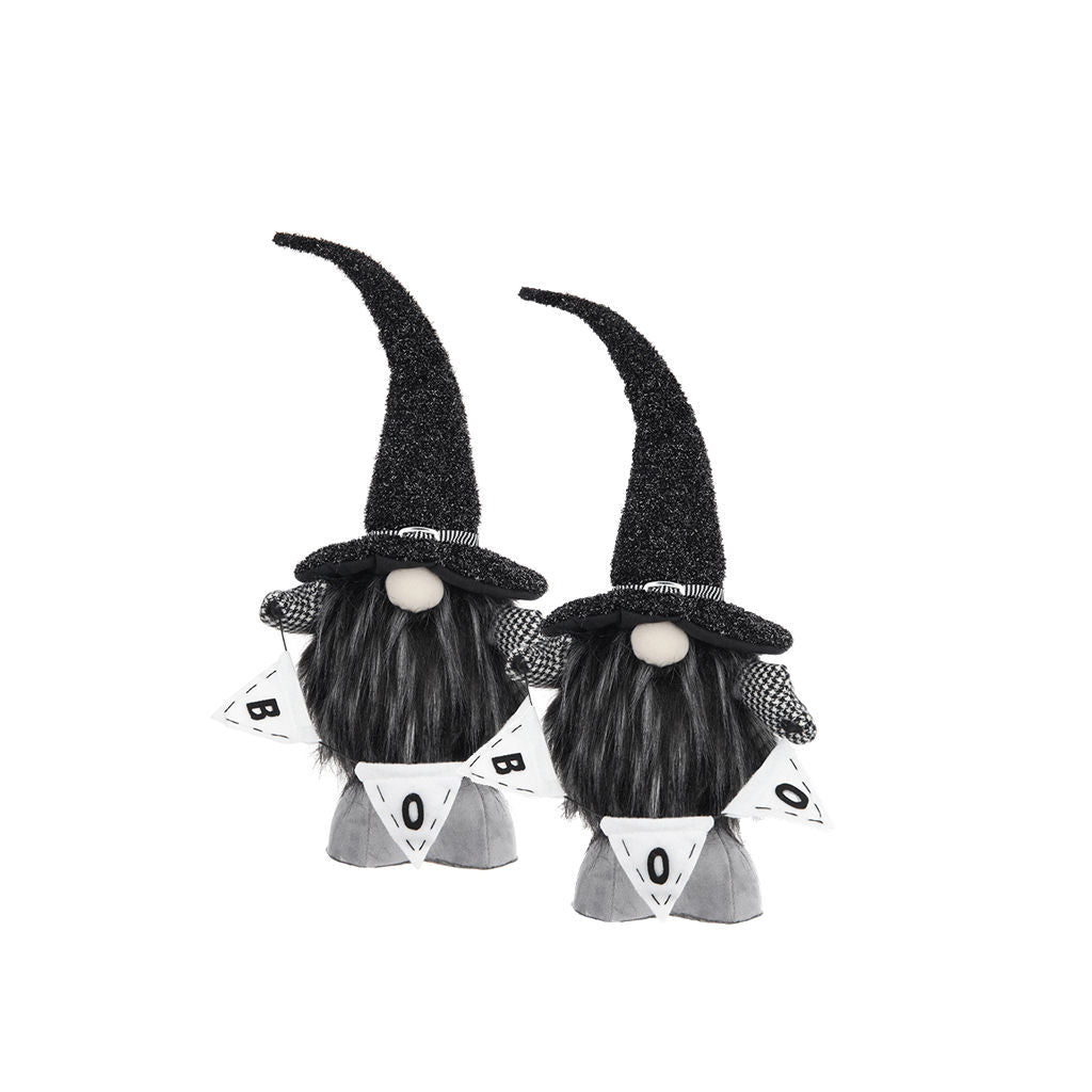 Two black and white Halloween gnome decorations with tall glittery black hats, long black beards, and white pennant banners that spell BOO, shown on a plain white background.