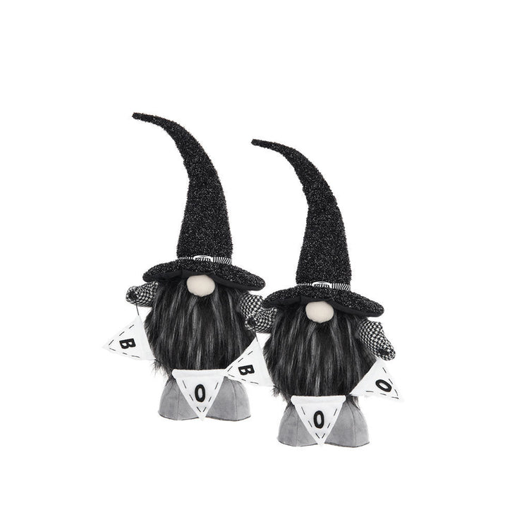 Two black and white Halloween gnome decorations with tall glittery black hats, long black beards, and white pennant banners that spell BOO, shown on a plain white background.