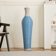 Tall 39-inch PVC floor vase decor placed in a cozy living room corner, enhancing interior with its elegant blue-striped design.