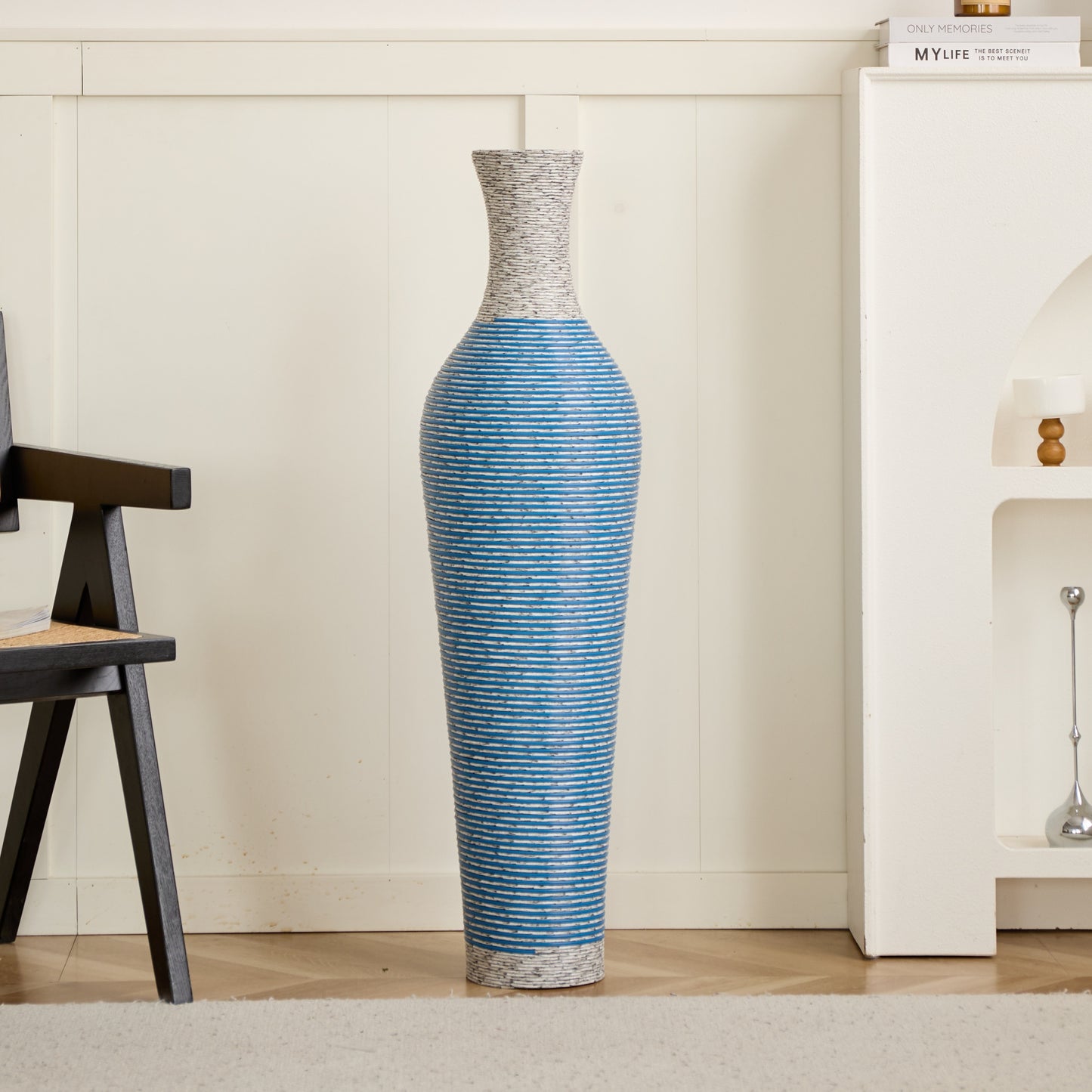 Tall 39-inch PVC floor vase decor placed in a cozy living room corner, enhancing interior with its elegant blue-striped design.