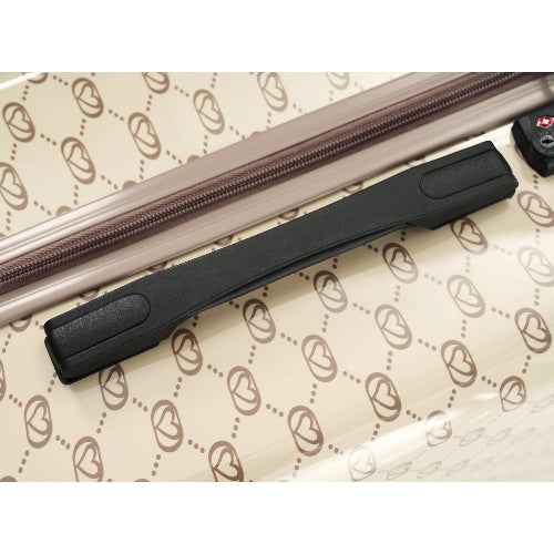 Black suitcase handle on a patterned surface