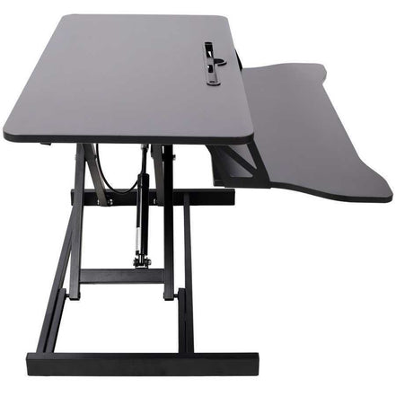 Front view of adjustable height laptop desk with extended keyboard tray, suitable for dual monitor or laptop setups.