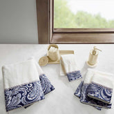 Jacquard bath towels with blue paisley pattern on white towels