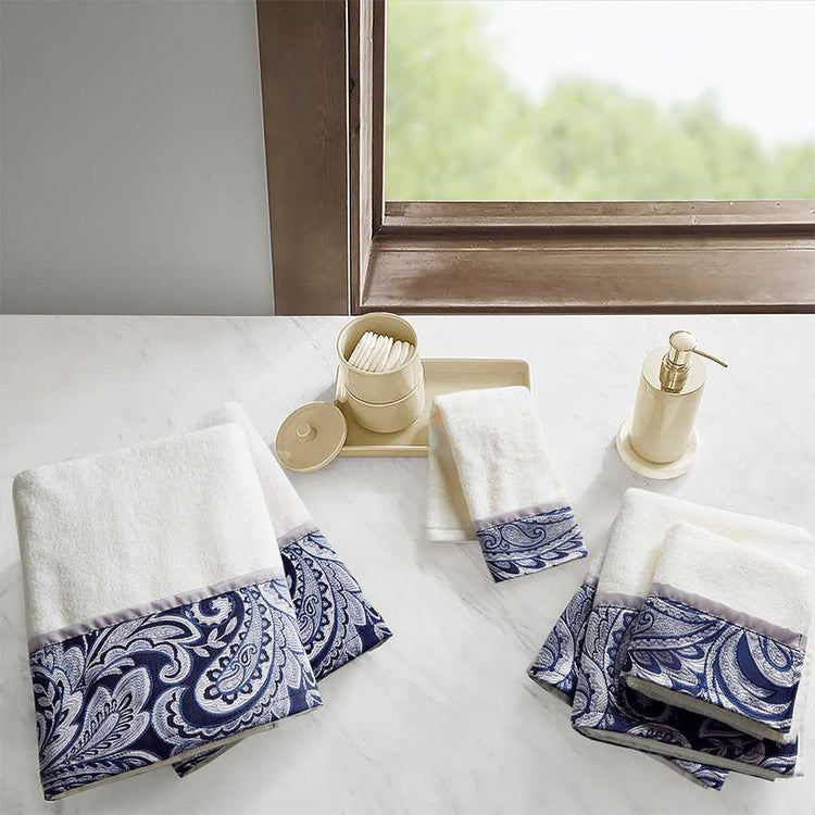 Jacquard bath towels with blue paisley pattern on white towels