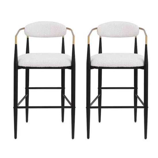 Two black bar stools with white cushioned seats on a white background