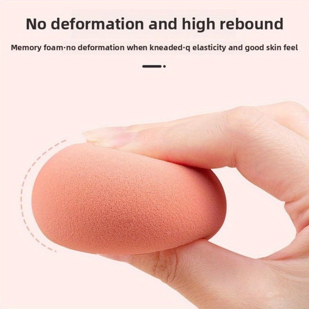 Close-up of peach beauty blender from the Pink Crystal Makeup Set showing high elasticity and soft memory foam for smooth blending.