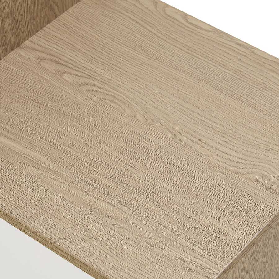 Close-up of the wood grain texture on the bench surface of the shoe storage unit, emphasizing its modern oak finish.