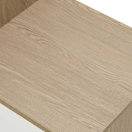Close-up of the wood grain texture on the bench surface of the shoe storage unit, emphasizing its modern oak finish.